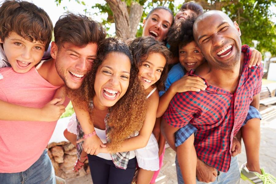 Family and friends smile before visiting their family dentist in Mililani, HI