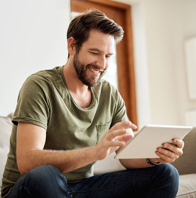 happy senior couple reading something on a tablet device