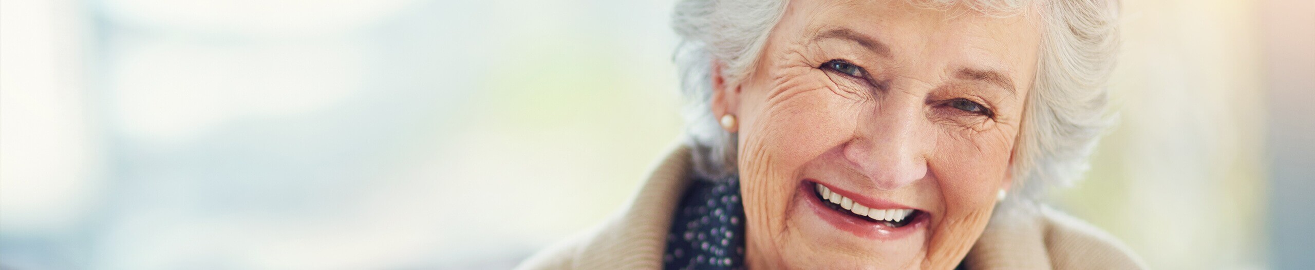 Elderly woman smiling with dentures