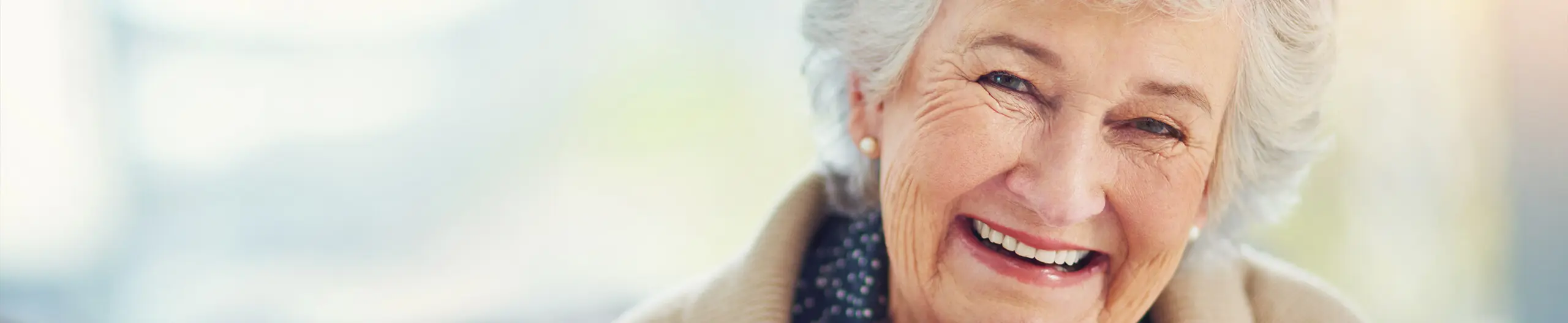 Elderly woman smiling with dentures