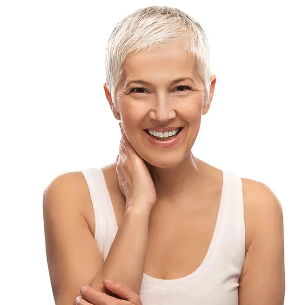 senior woman in white smiling