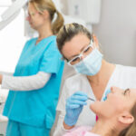 woman in the dentist chair getting a dental crown