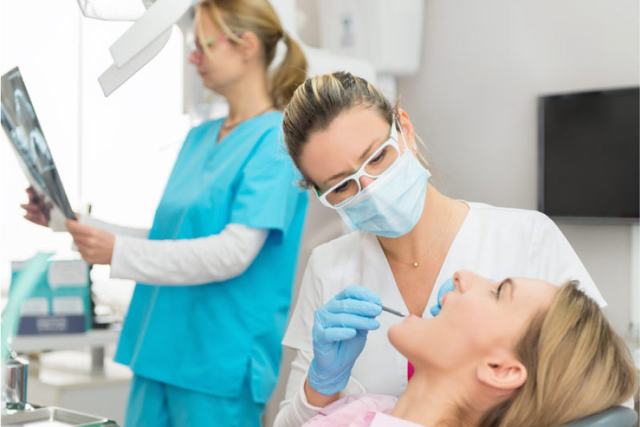 woman in the dentist chair getting a dental crown