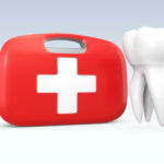 dental emergency first aid kit next to a tooth