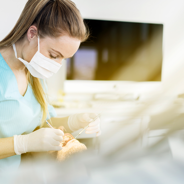dentist cleaning patient